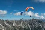 DOUBLESKIN - Minimalist hike & fly The DOUBLESKIN is the lightest paraglider in the world* with top and under surface (2.1 kg / size 17). It has a very small pack size and is a delight in the air thanks to better aerodynamics compared to a single-surface wing. With the DOUBLESKIN walking up is as enjoyable as flying and landing!